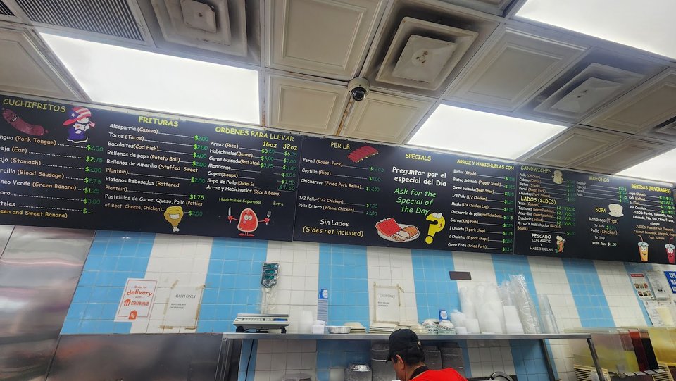 Counter service inside a compact Puerto Rican restaurant.